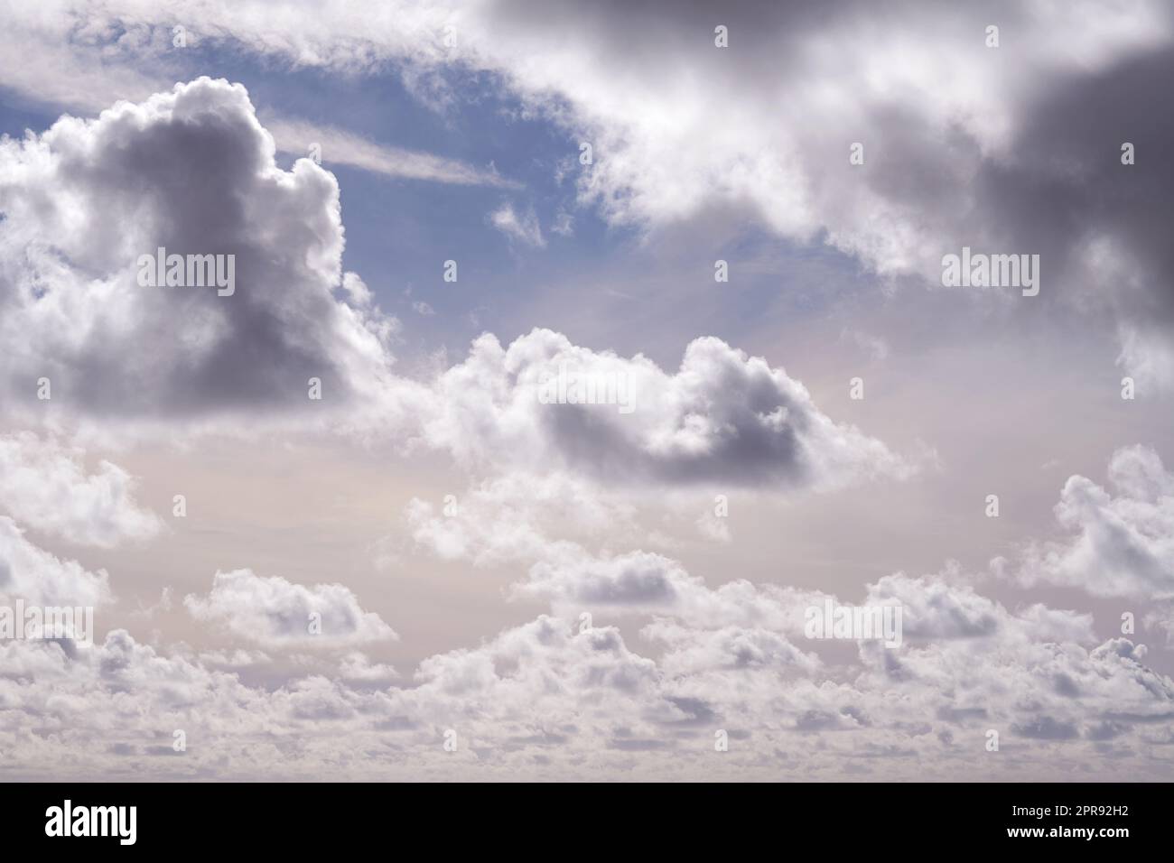 Beautiful view of cumulus clouds in a blue sky with copy space. Soft