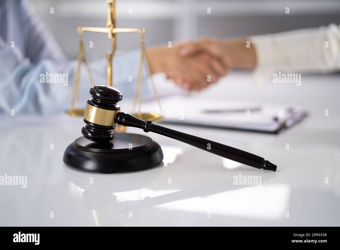 Lawyer Client Handshake In Courtroom Stock Photo
