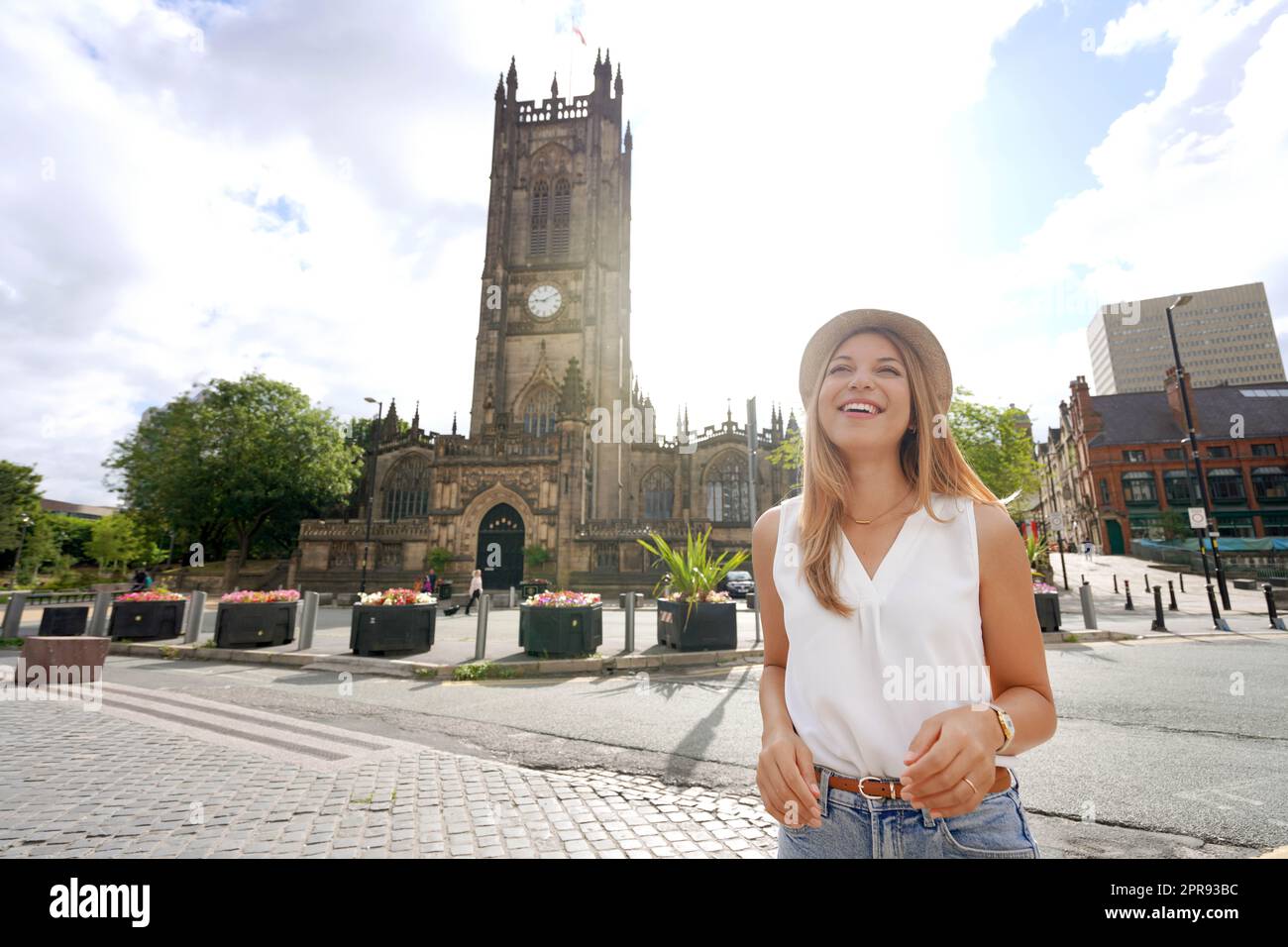 Beautiful young woman in the city of Manchester on sunny day, England Stock Photo