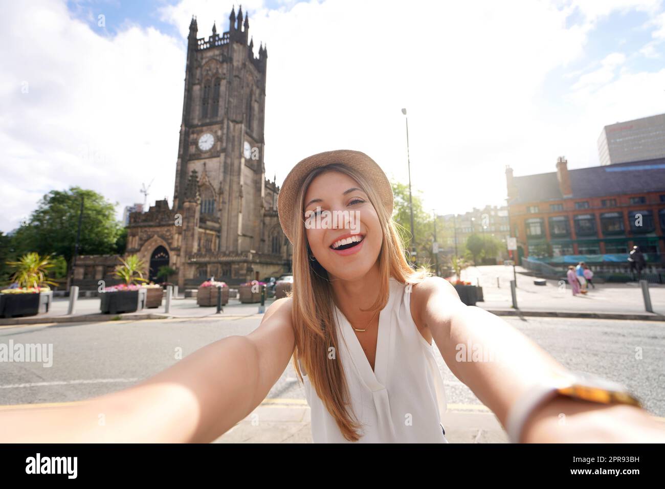 Smiling girl takes selfie photo in Manchester, England, United Kingdom Stock Photo