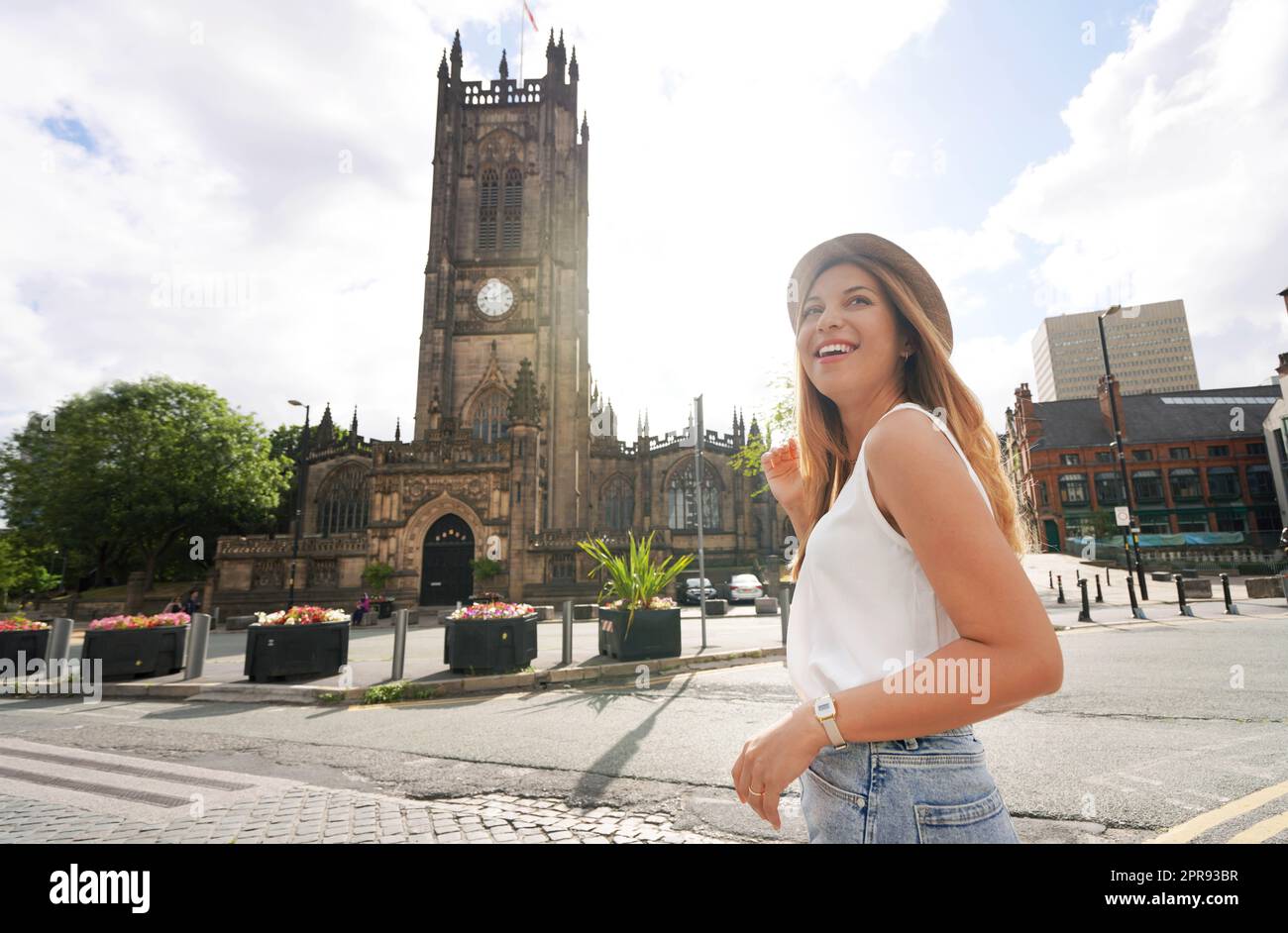 Portrait of gorgeous woman walking on sunny day in the city of Manchester, UK Stock Photo