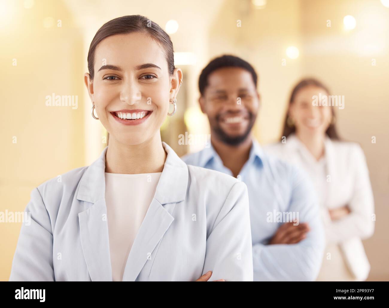 Make the most of your strengths and abilities. Portrait of a young businesswoman standing in an office with her colleagues in the background. Stock Photo