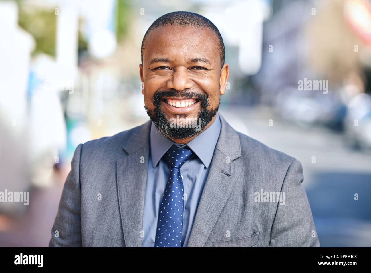 Its always a good day to work towards your goals. a businessman wearing a suit while out in the city. Stock Photo