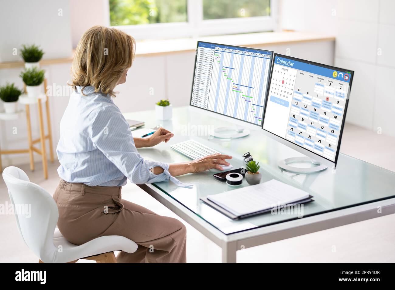 Employee Using Schedule Calendar Stock Photo