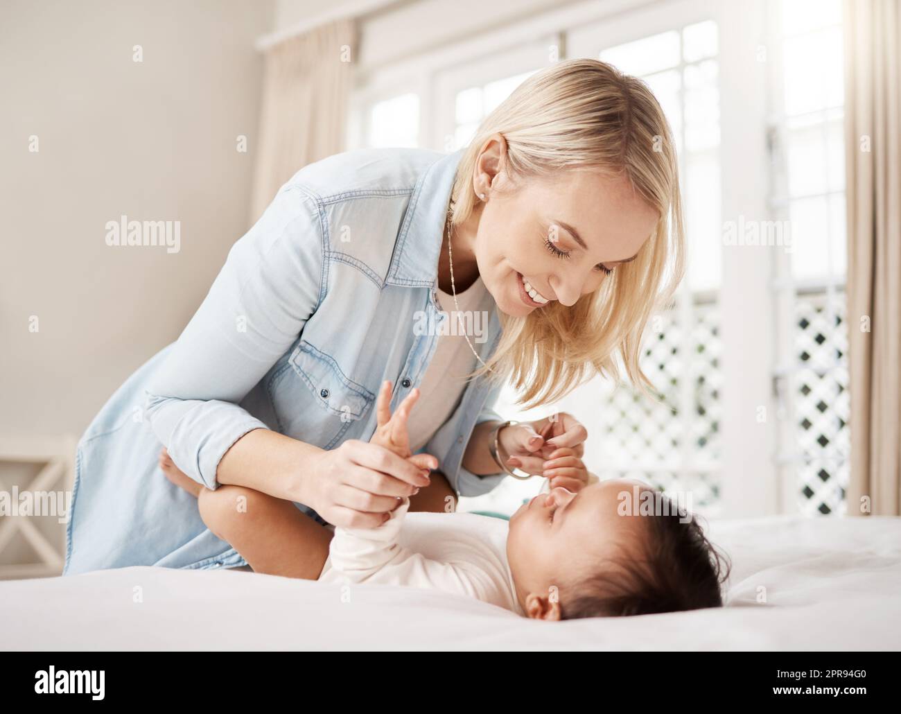 Are you ready for another fun day. a woman bonding with her baby at home. Stock Photo