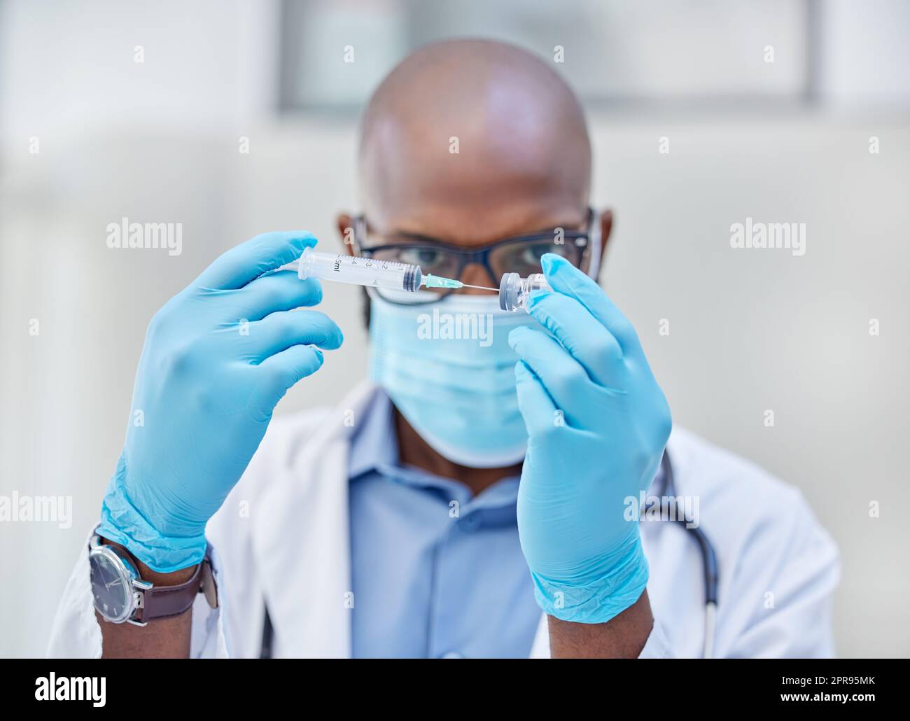 A whole lot of protection in a tiny tube. a young doctor using a