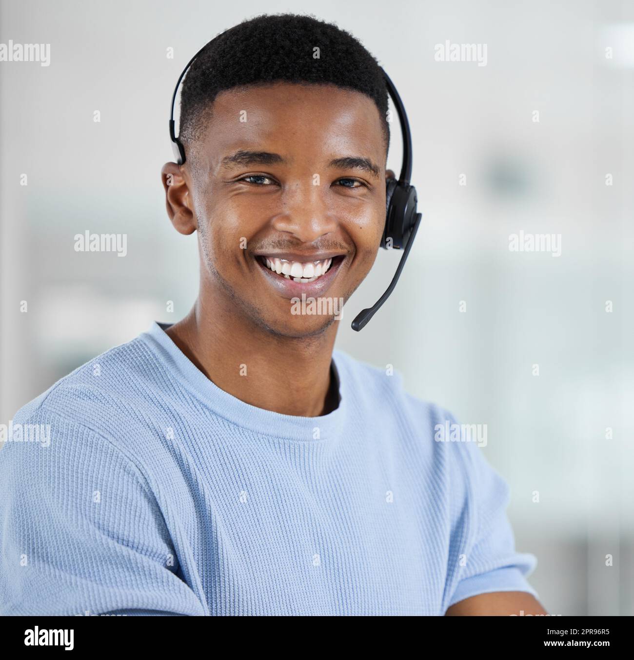 Building customer loyalty starts with exceptional customer service. Portrait of a young businessman working in a call centre. Stock Photo