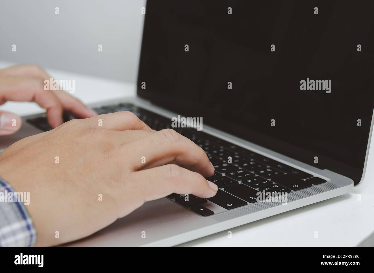Hand man using keyboard computer laptop digital internet technology network browsing and shopping online and social media. Stock Photo