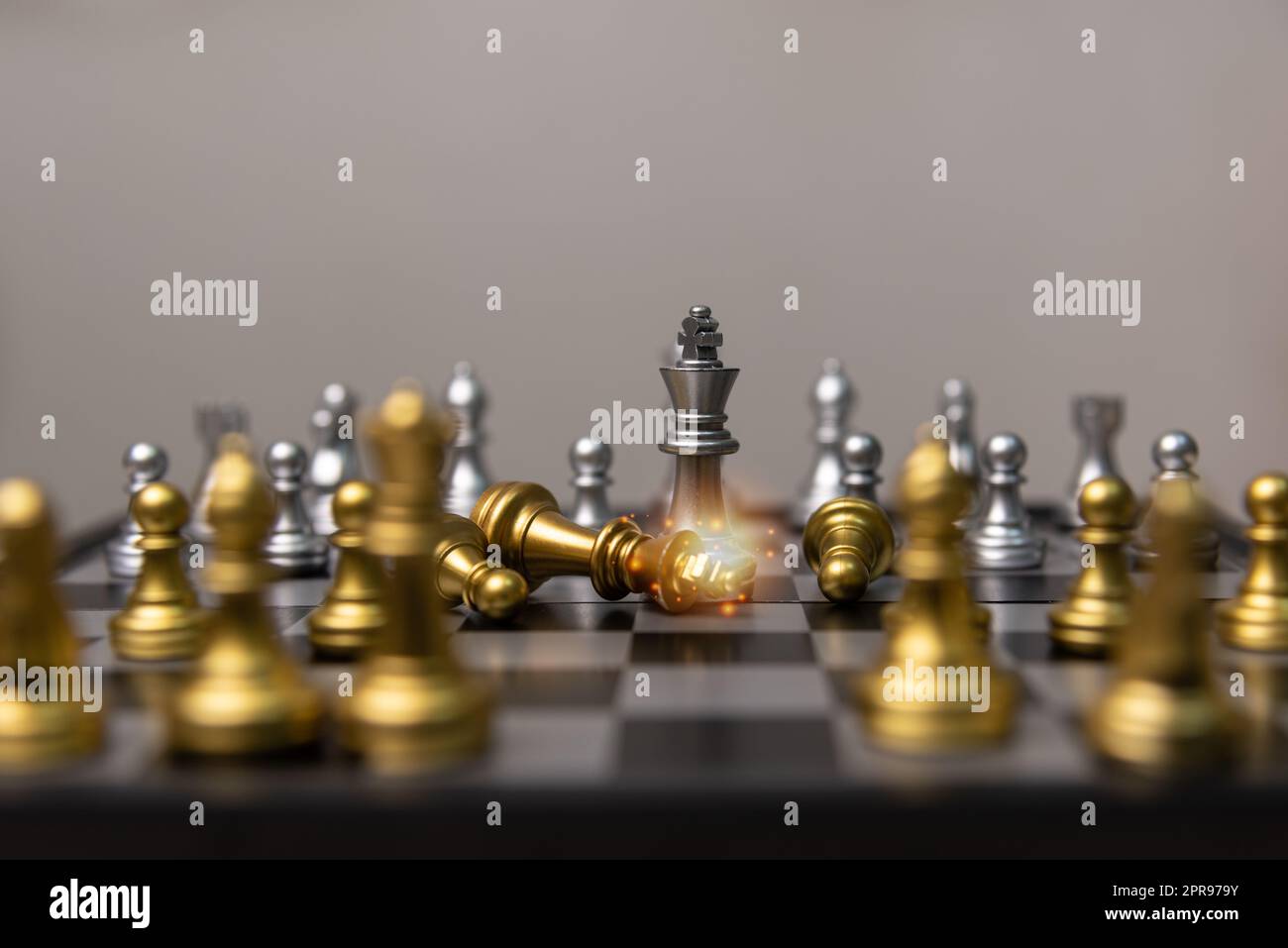 silver and gold chess on the board.Business investment finance marketing planning concept. Stock Photo