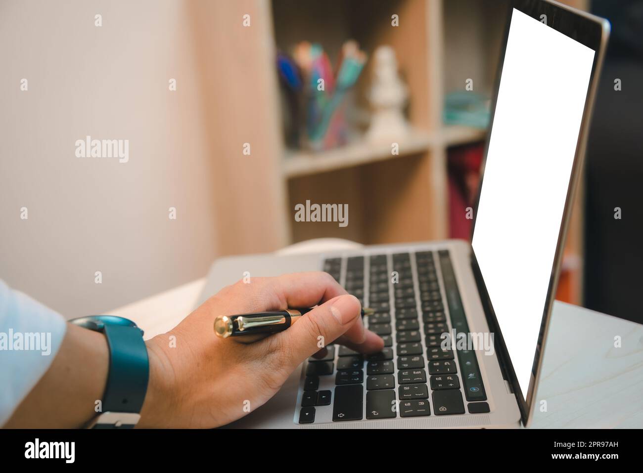 Hand man using keyboard computer laptop digital internet technology network browsing and shopping online and social media mock up white screen. Stock Photo