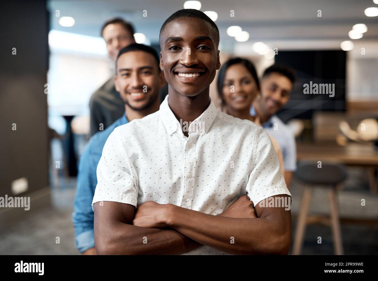 Fiercely determined all the way to the finish line. Portrait of a group of confident young businesspeople working together in a modern office. Stock Photo