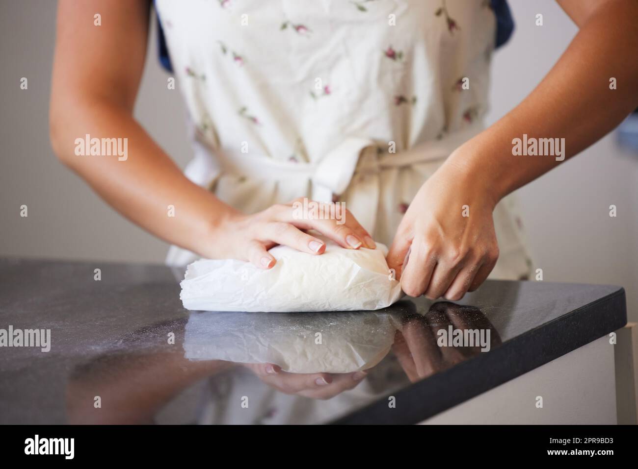 Take care of your body. a unrecognizable female baking in the kitchen at home. Stock Photo