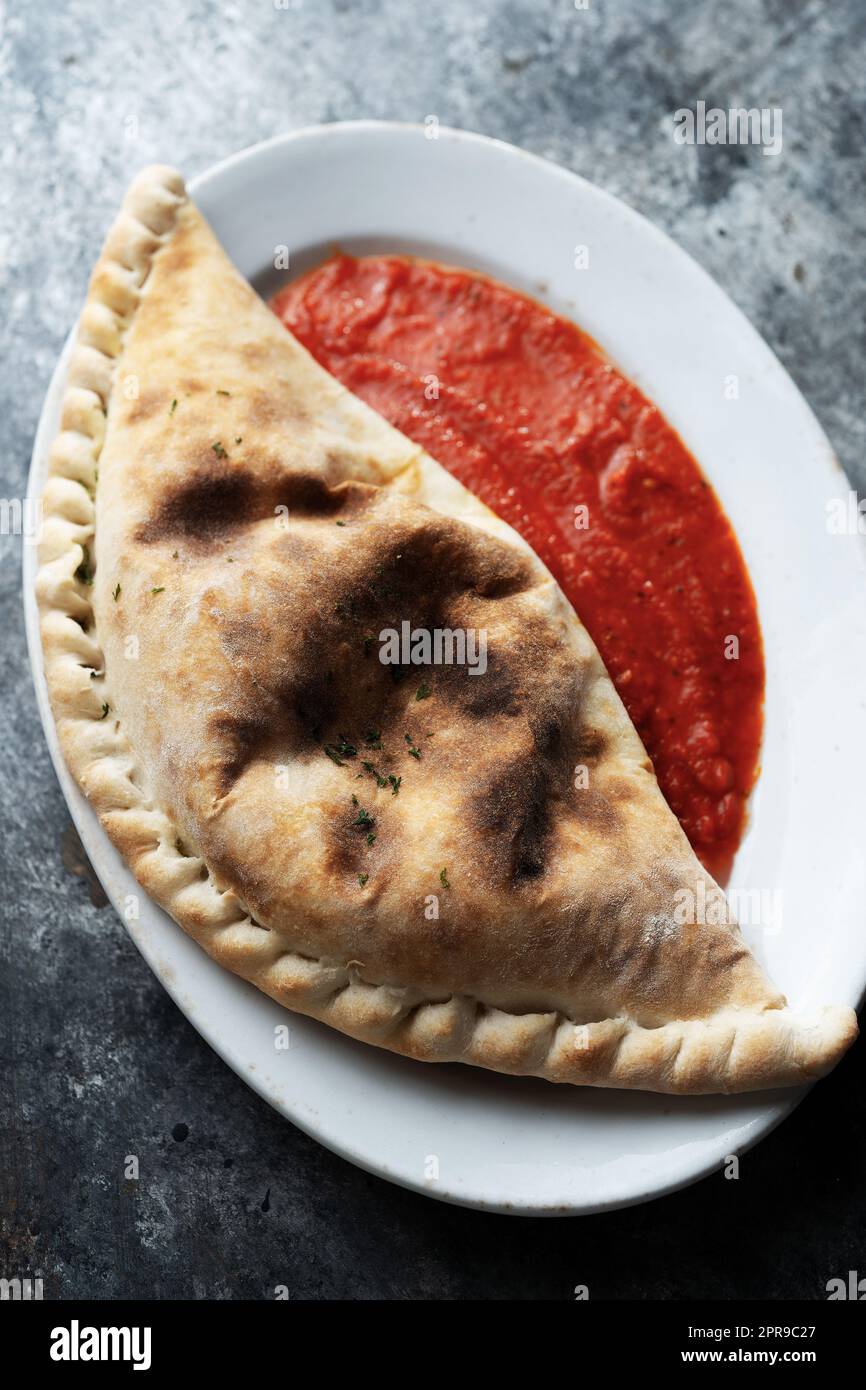 italian calzone folded pizza Stock Photo - Alamy