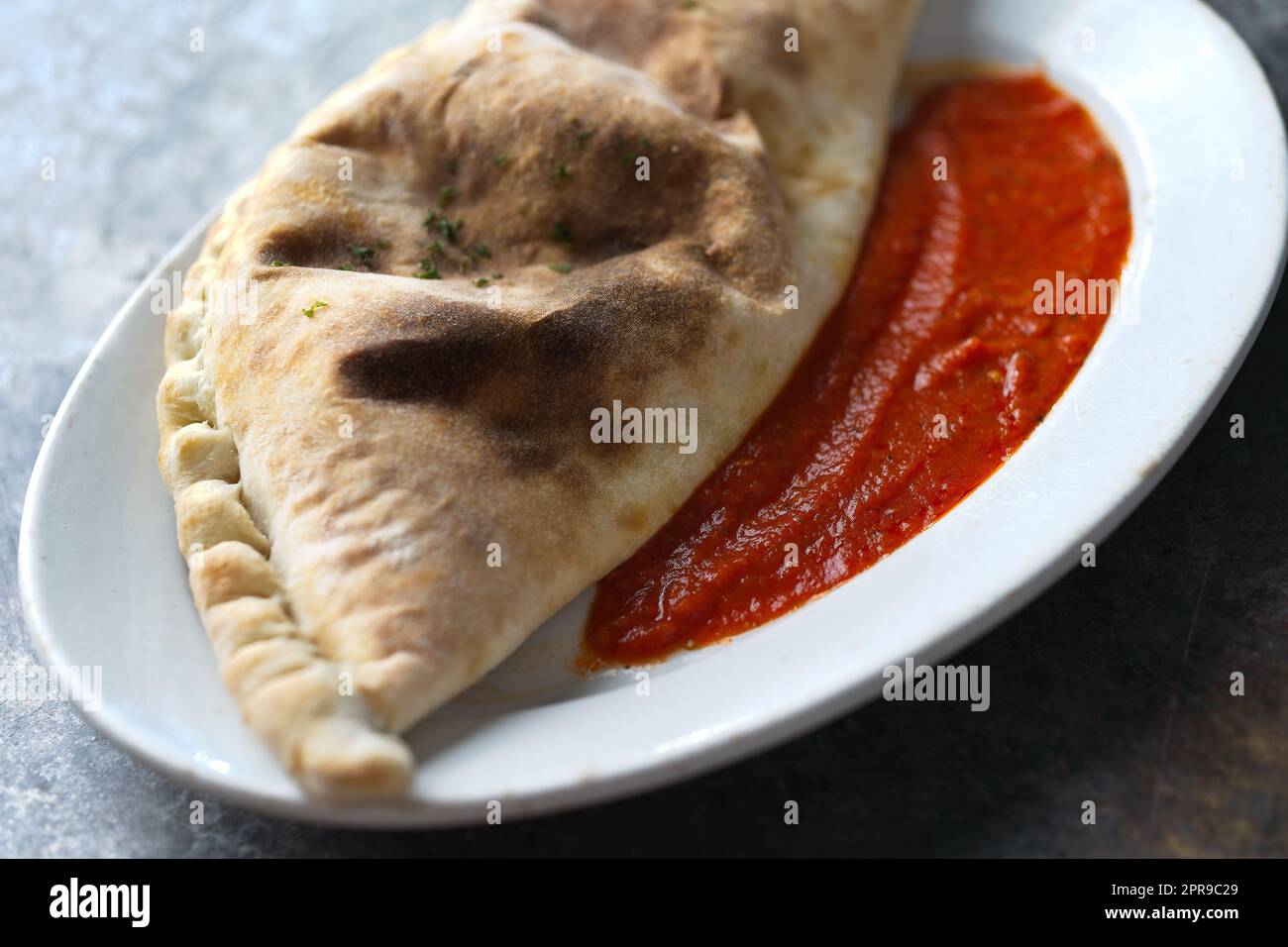 italian calzone folded pizza Stock Photo - Alamy