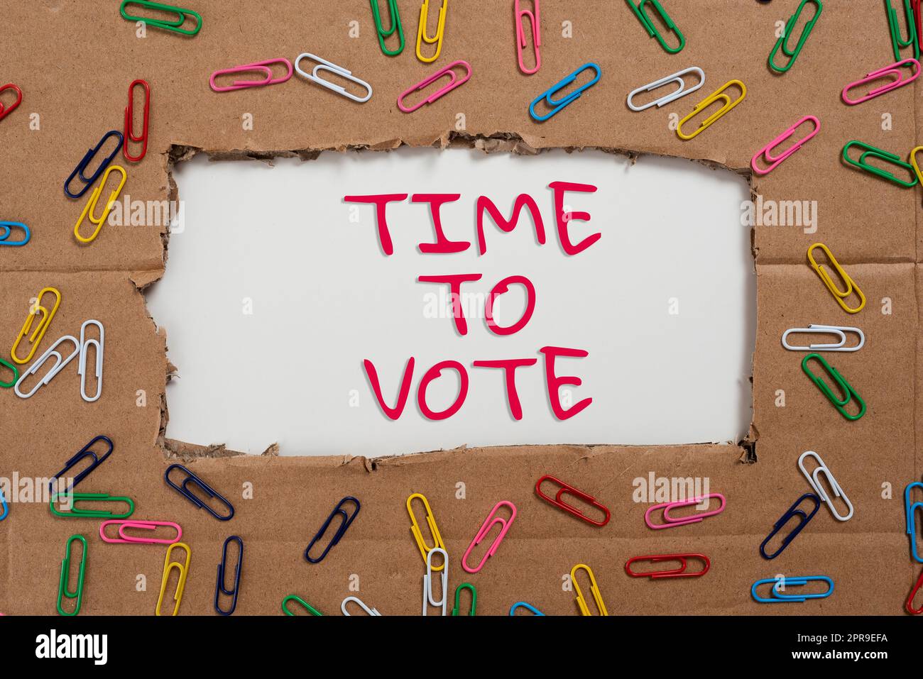 Text showing inspiration Time To Vote. Business approach Election ahead choose between some candidates to govern Important Ideas Written Under Ripped Cardboard With Paperclips Around. Stock Photo