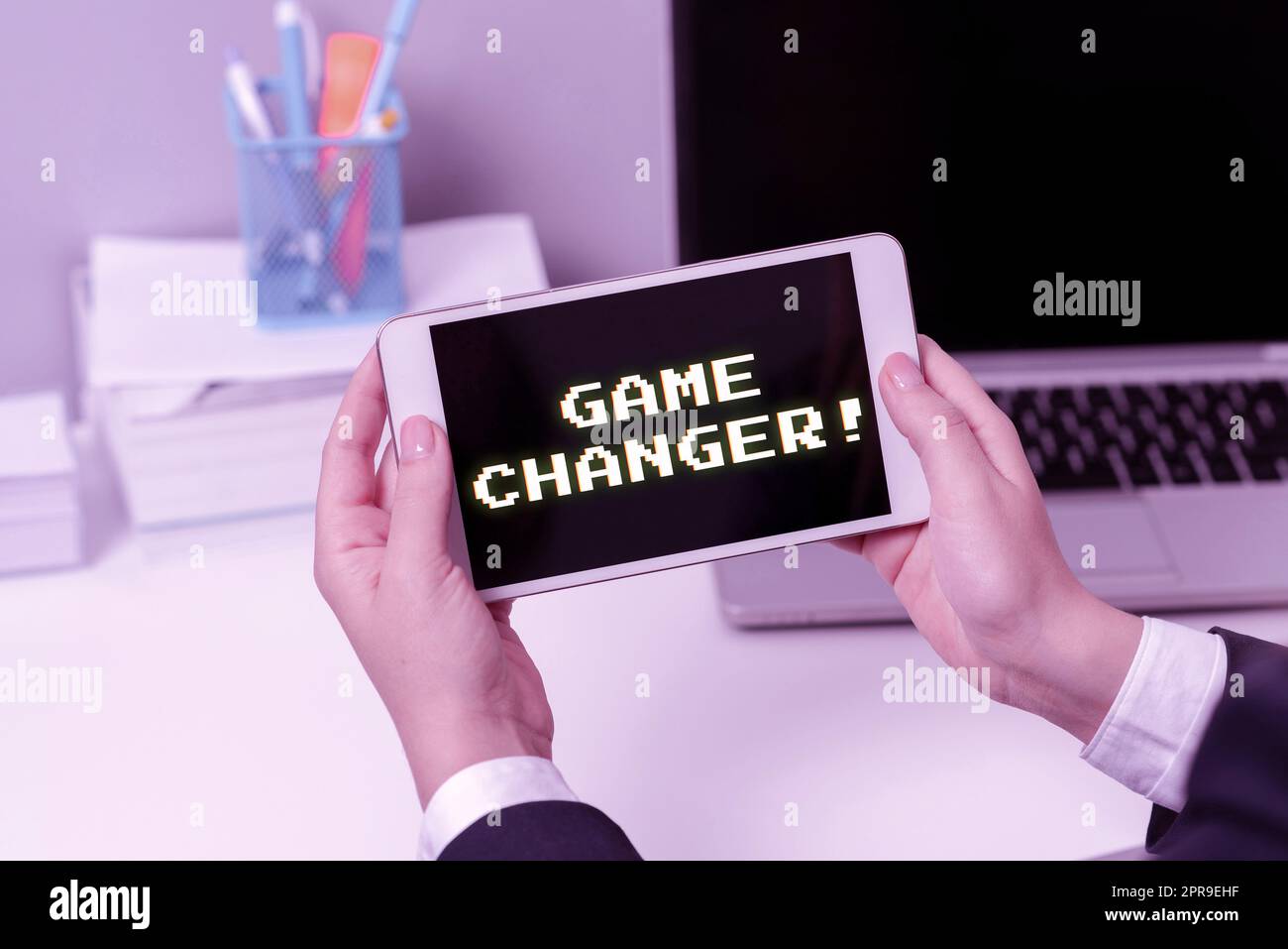 Hand writing sign Game Changer. Business idea Sports Data Scorekeeper Gamestreams Live Scores Team Admins Sitting Businesswoman Holding Mobile Phone With Important Messages. Stock Photo