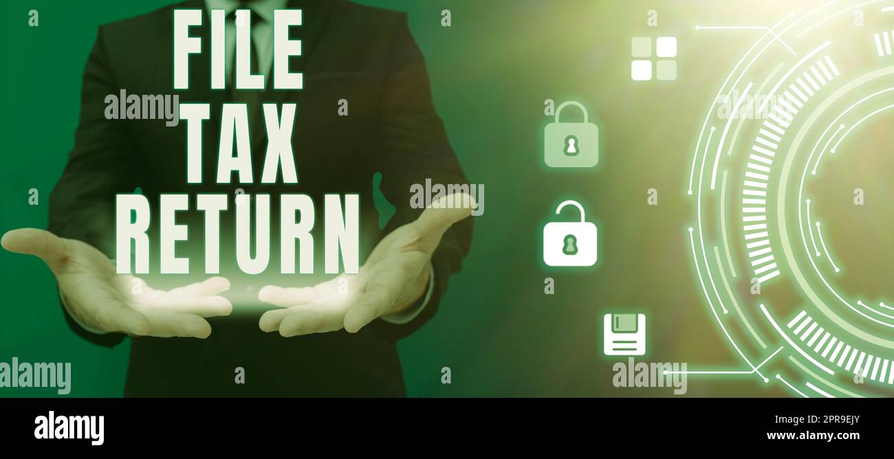 Writing displaying text File Tax Return. Word for Paperwork to get financial money returning accountant job Business Person Describing Computer Smart Technology System In Hands Stock Photo