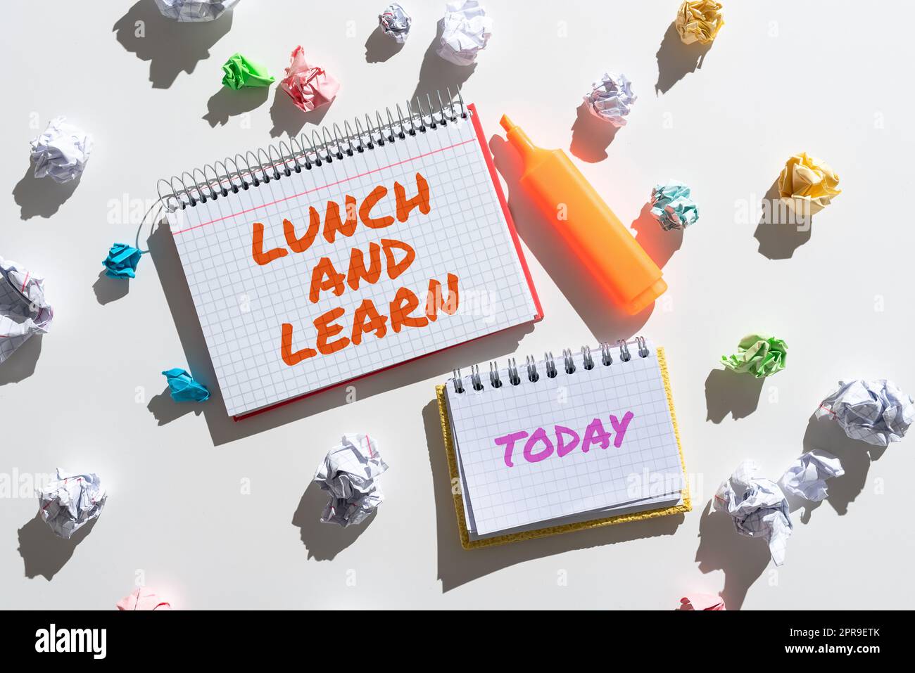 Text caption presenting Lunch And Learn. Business approach Have meal and study motivation for education learning eating Notebooks With Important Messages Surrounded By Paper Wraps. Stock Photo