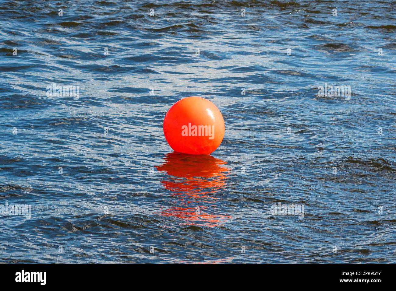 Orange buoy ready for the race Stock Photo