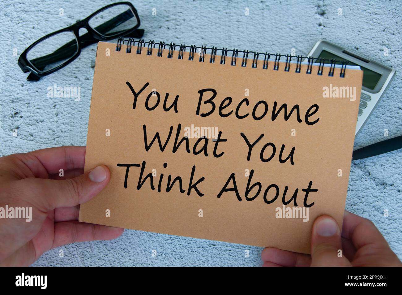 You become what you think about text written on brown notepad. Motivational concept. Stock Photo