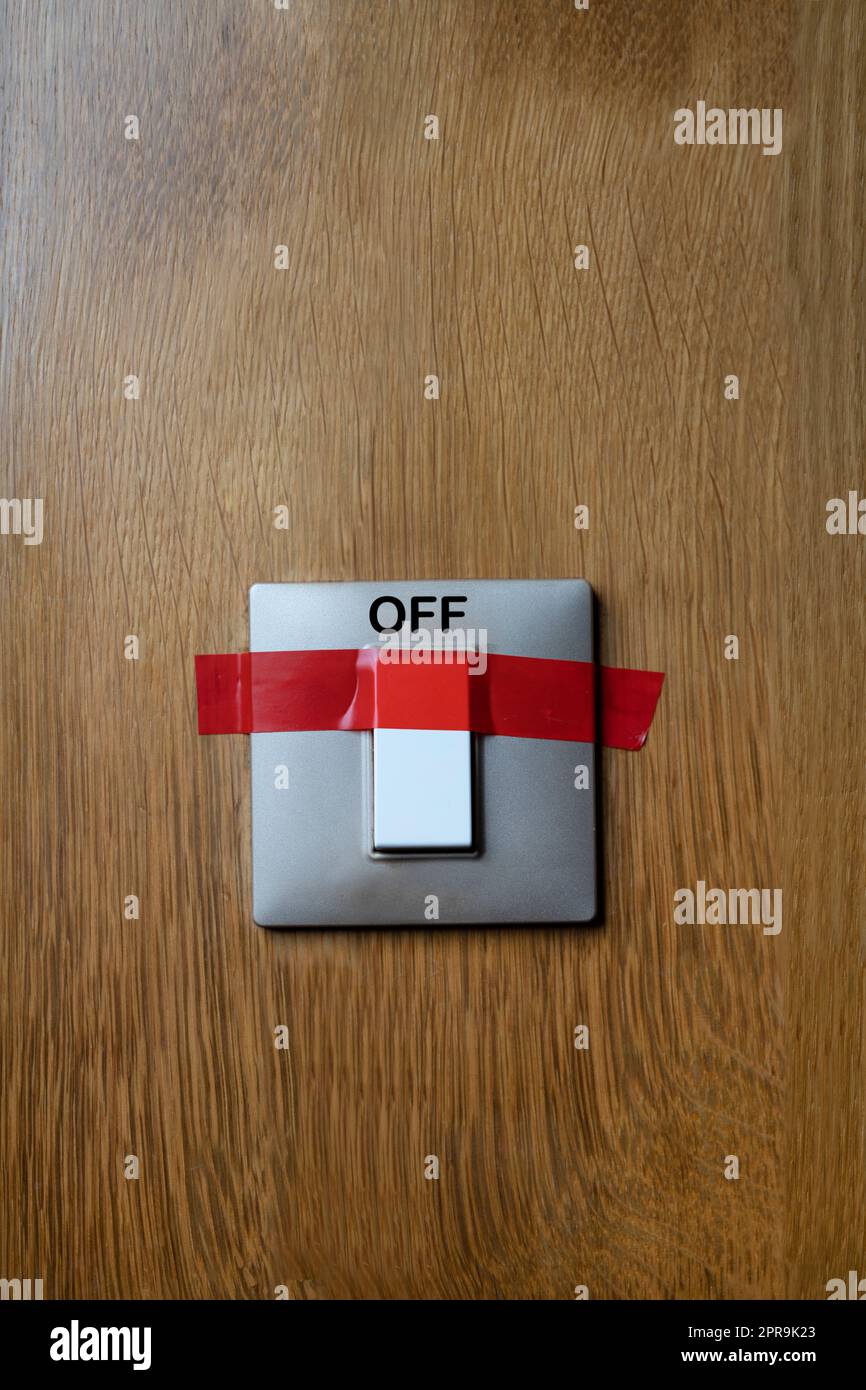 a switch stuck with red tape in the off position Stock Photo Alamy