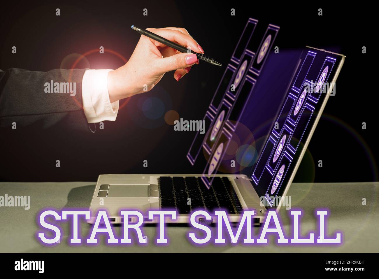 Text showing inspiration Start Small. Internet Concept Small medium enterprises start up Business entrepreneurship Businesswoman Pointing With Pen Important Message On Lap Top Screen. Stock Photo