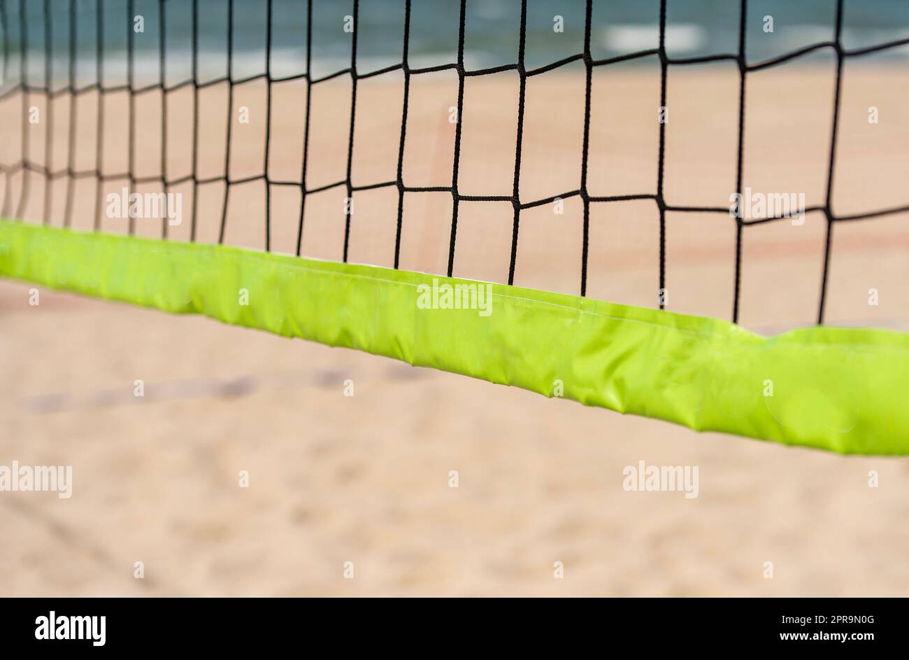 Beach volleyball and beach tennis net on the background of sand. Sport team concept. Horizontal