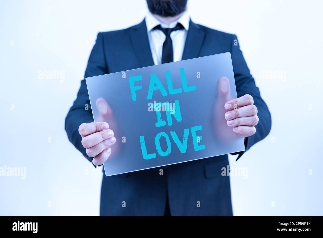 Conceptual caption Fall In Love. Word Written on Feeling loving emotions about someone else Romance Happiness Man Holding Blank Placard And Representing Business Advertisement. Stock Photo