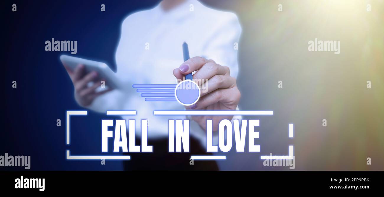Conceptual caption Fall In Love. Business concept Feeling loving emotions about someone else Romance Happiness Businessman in suit holding notepad symbolizing successful teamwork. Stock Photo