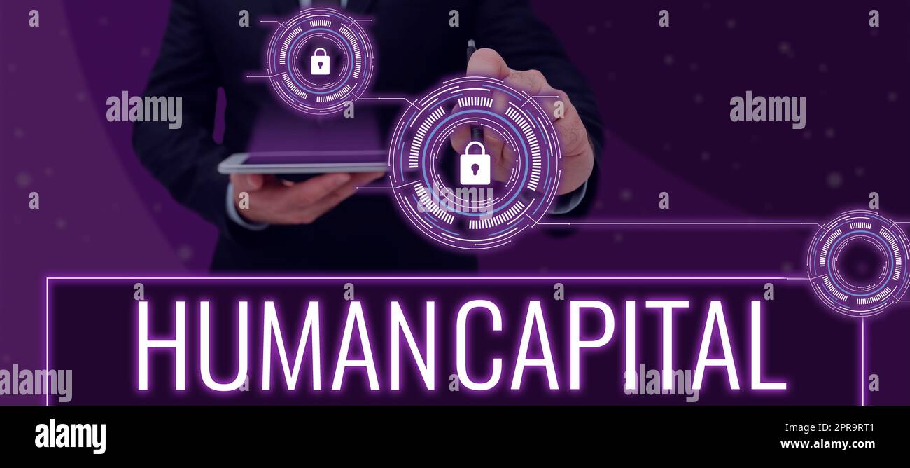 Conceptual caption Human Capital. Word for Intangible Collective Resources Competence Capital Education Man Holding Pen And Tablet In Hands Pointing Security System Technologyy Stock Photo