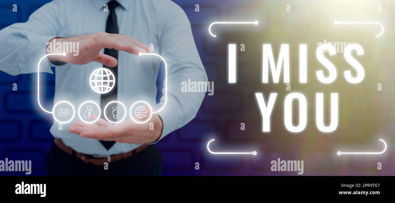 Conceptual caption I Miss You. Word Written on Feeling sad because you are not here anymore loving message Man With Futuristic Frame In Hands Showing Digital Display Of S. Stock Photo