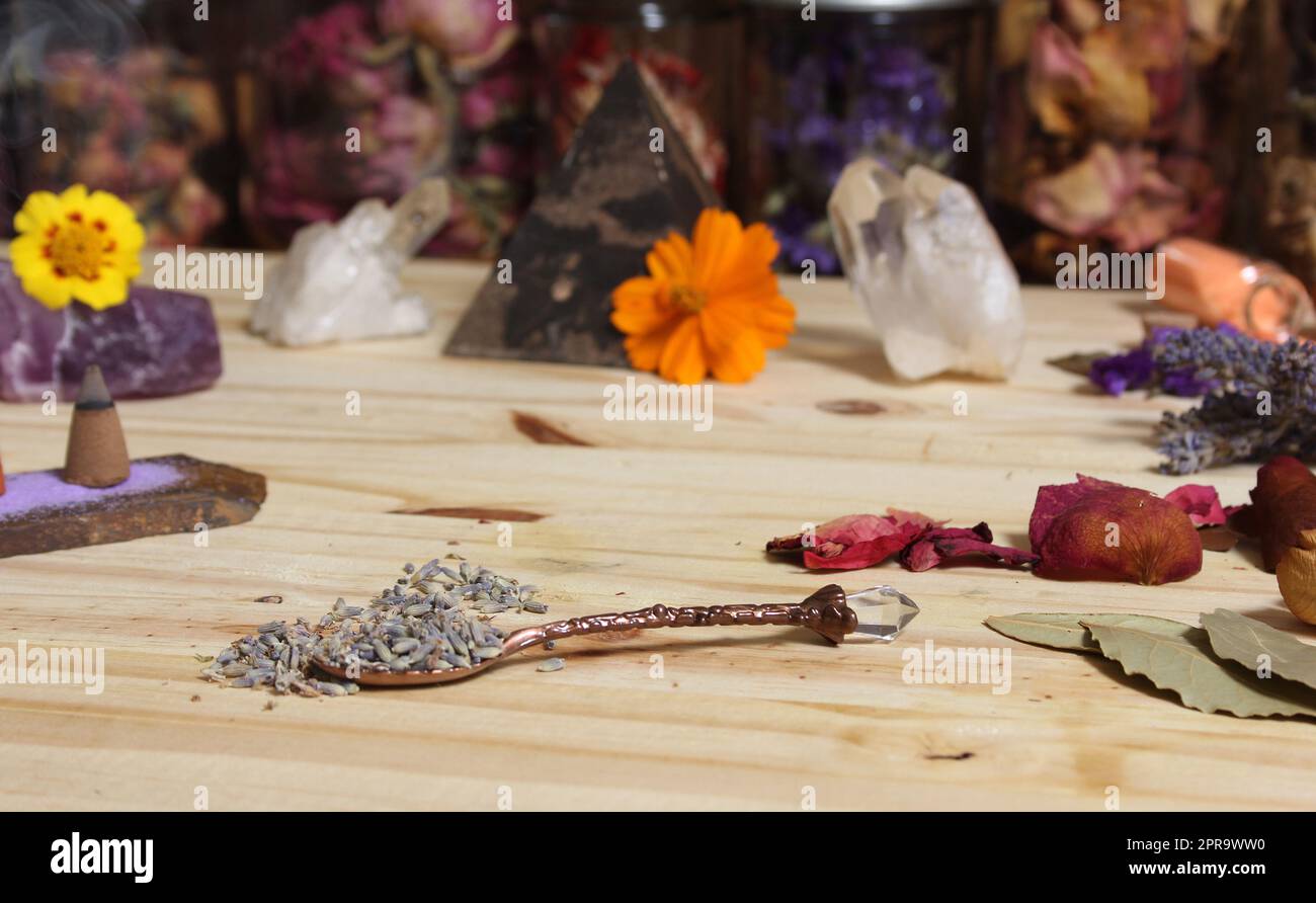 Dried Lavender and Rose Petals on Table With Incense Cones and Crystals Stock Photo