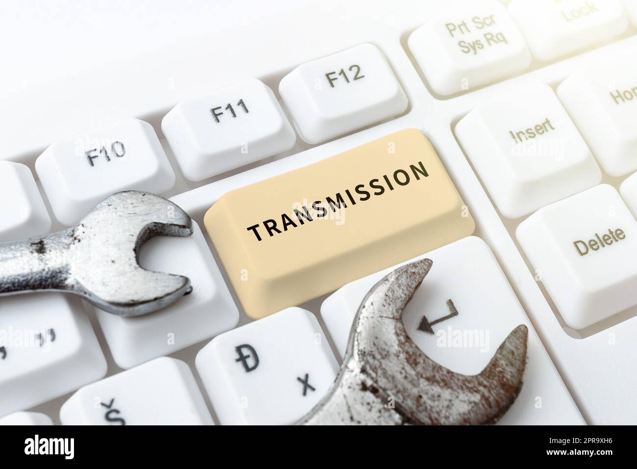 Hand writing sign Transmission. Word Written on Automobile engine part