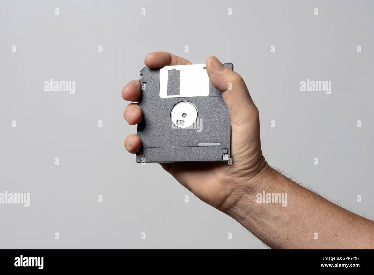 Floppy disk on hand Stock Photo