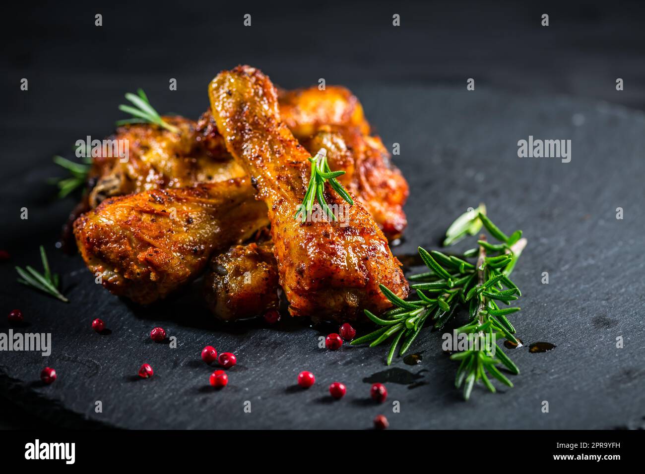 Oven baked chicken drumsticks Stock Photo