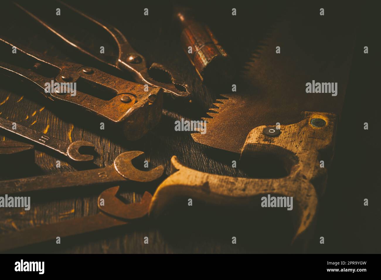 Collection of vintage carpentry tools on old workbench: woodworking, craftsmanship Stock Photo