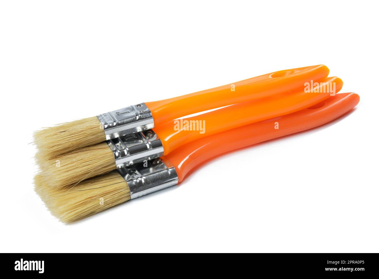 New paint brush with orange handle isolated on white background Stock Photo