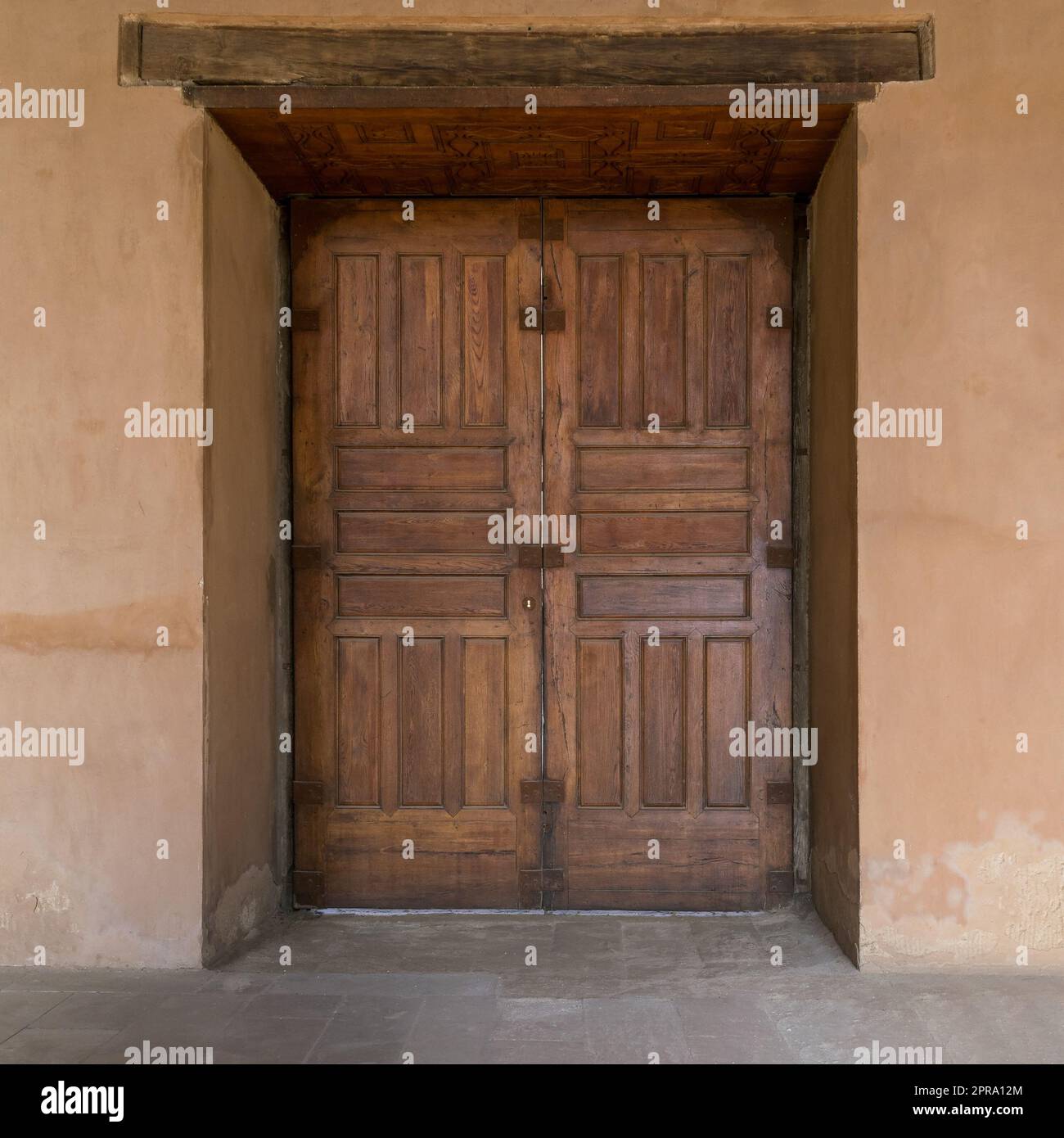 Grunge wooden aged door on grunge stone wall Stock Photo - Alamy
