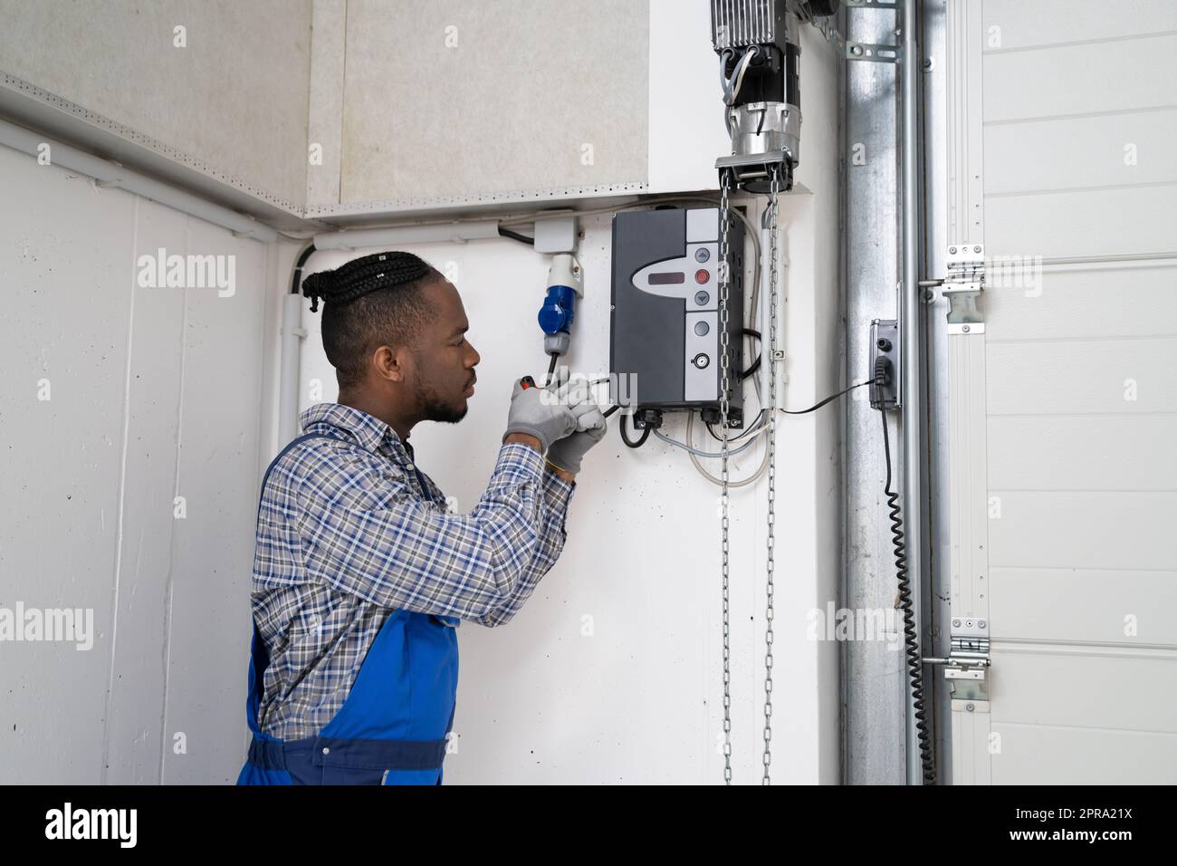 Installing Automatic Garage Door Or Gate Stock Photo Alamy