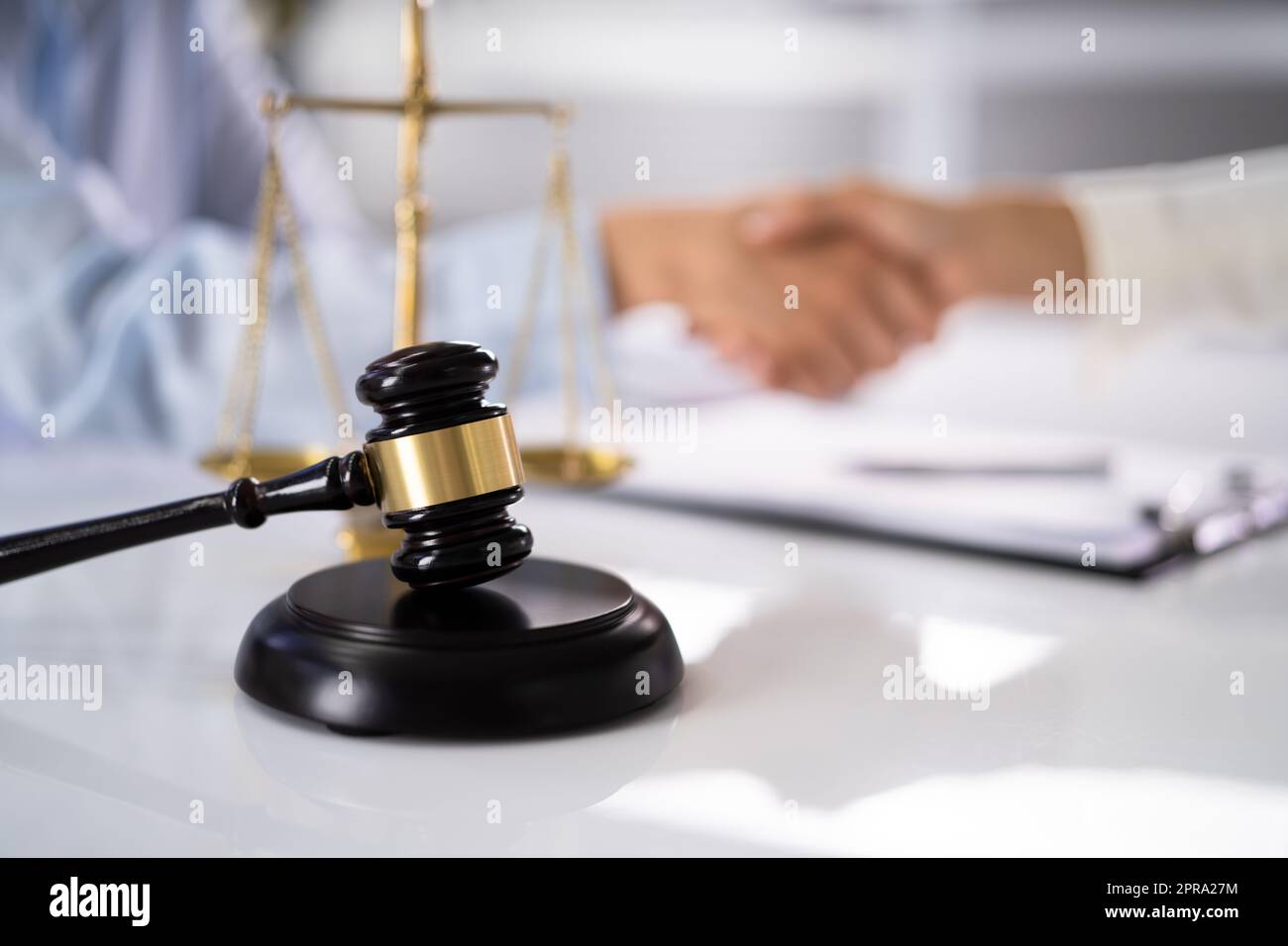Lawyer Client Handshake In Courtroom Stock Photo