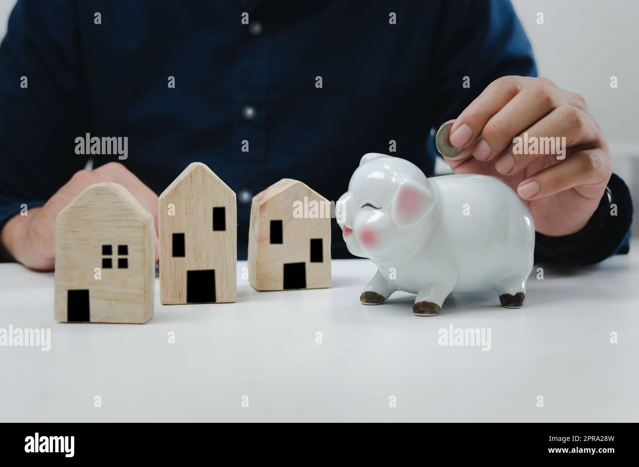 Saving money business finance, banking and investment in real estate or buying and selling houses. Stock Photo