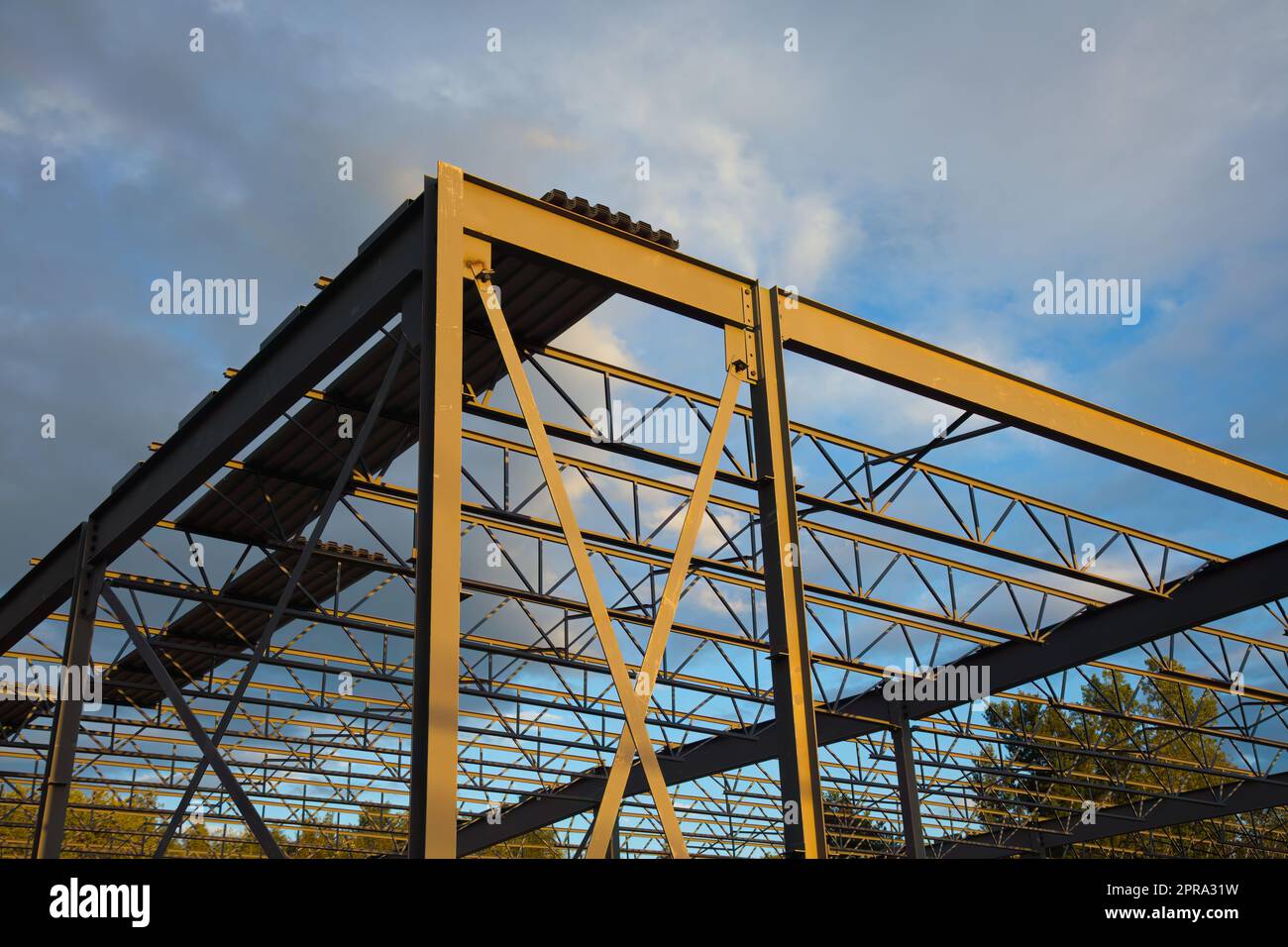 construction site metal frame building iron beams roof structure Stock
