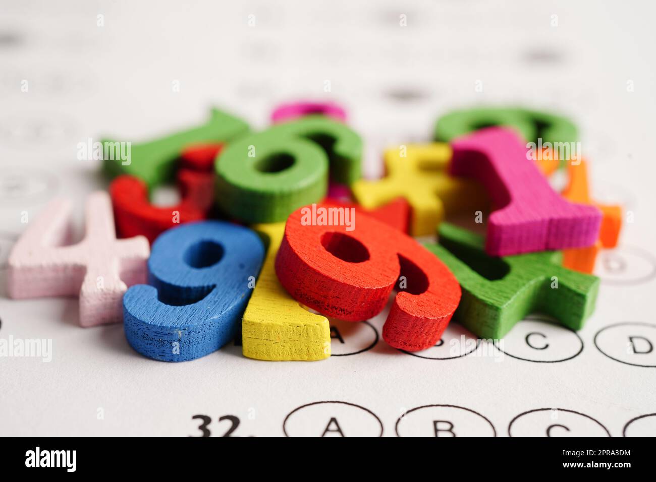 Math number with pencil on answer sheet test choice for learning