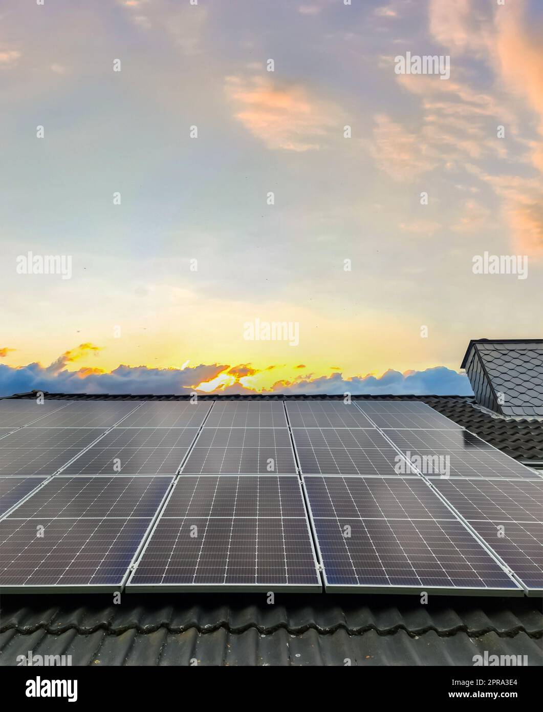 Solar panels producing clean energy on a roof of a residential house ...