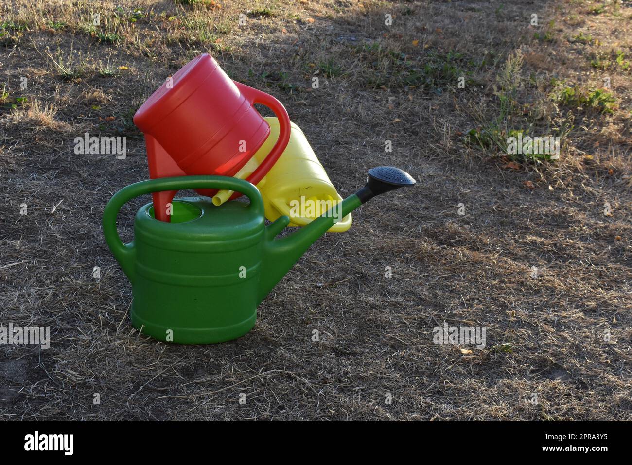 Watering can principle Stock Photo Alamy