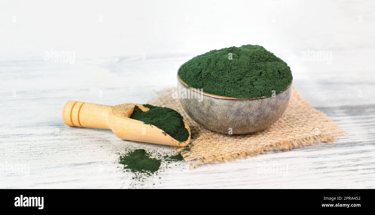 Spirulina algae powder in a bowl, alternative medicine for to detox, antioxidant food ingredients Stock Photo