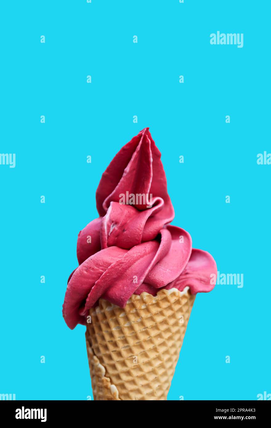 A waffle ice cream cone filled with a delicious freshly made raspberry