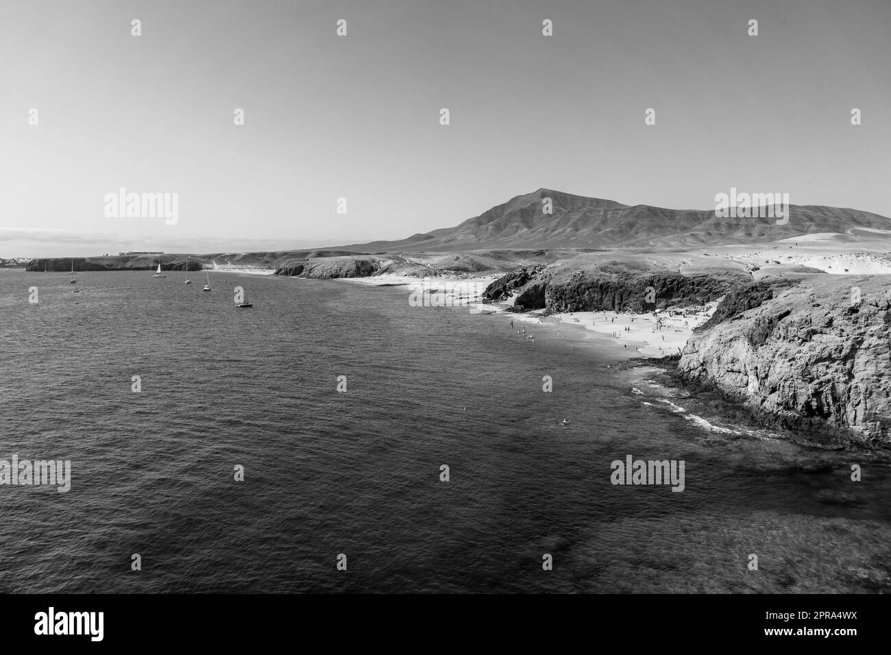 Playa de la Cera, Playa del Pozo and Playa Mujeres are popular and beautiful beaches in Lanzarote, Canary Islands, Spain. Black and white. Stock Photo