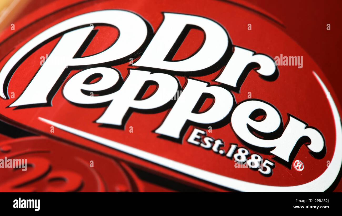Dr. Pepper carbonated soft drink logo on a aluminum can rolling in, object macro, detail, extreme closeup. Sweet sugary drink brands simple concept, n Stock Photo