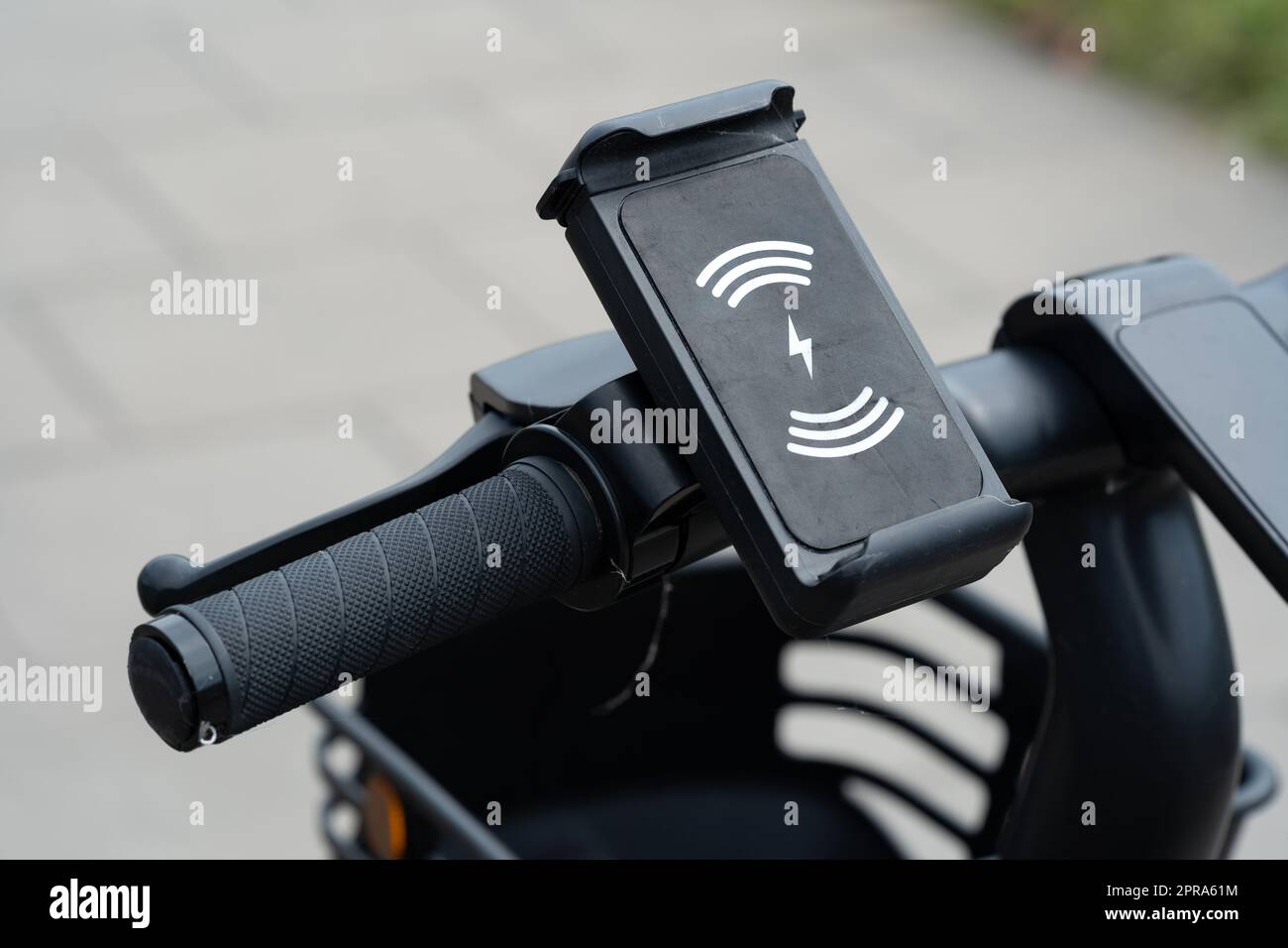 Place for a smartphone, mobile phone on an electric scooter, phone holder on an electric vehicle, city urban area, mobility as a service simple concep Stock Photo